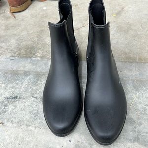 Brand new black rain boots.  Narrow toe.  Itsy tiny heel.